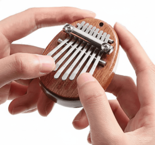 Mini Wooden Kalimba (8 - Key) – Pocket Thumb Piano Musical Instrument - Drop & Co.